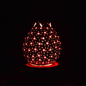 Small table lamp made of carved beaded pumpkin.